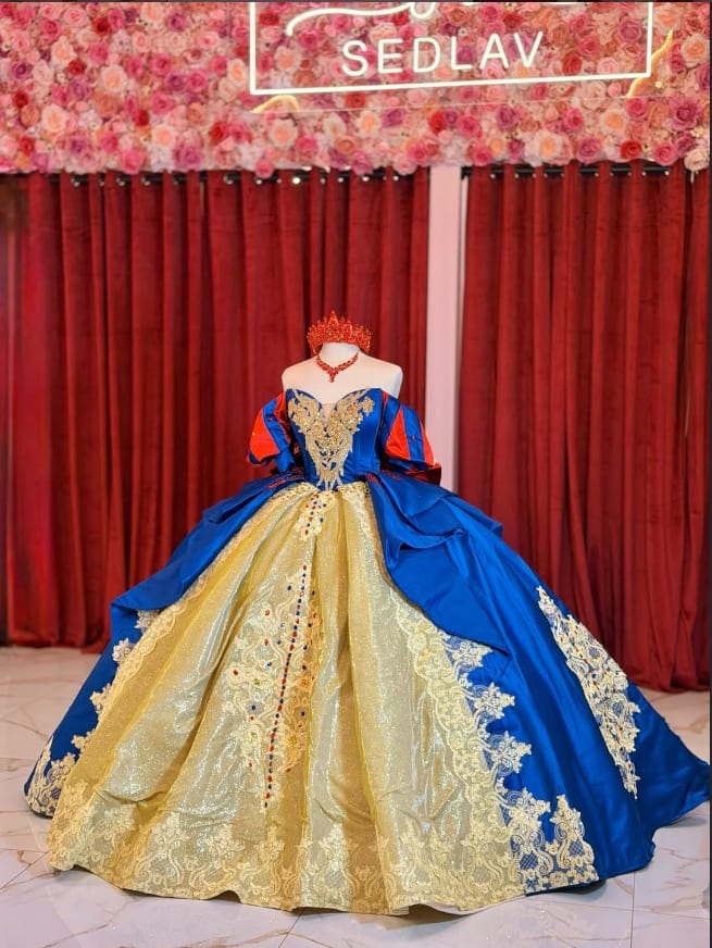 Royal blue and gold quinceañera ball gown with a jewelled bodice